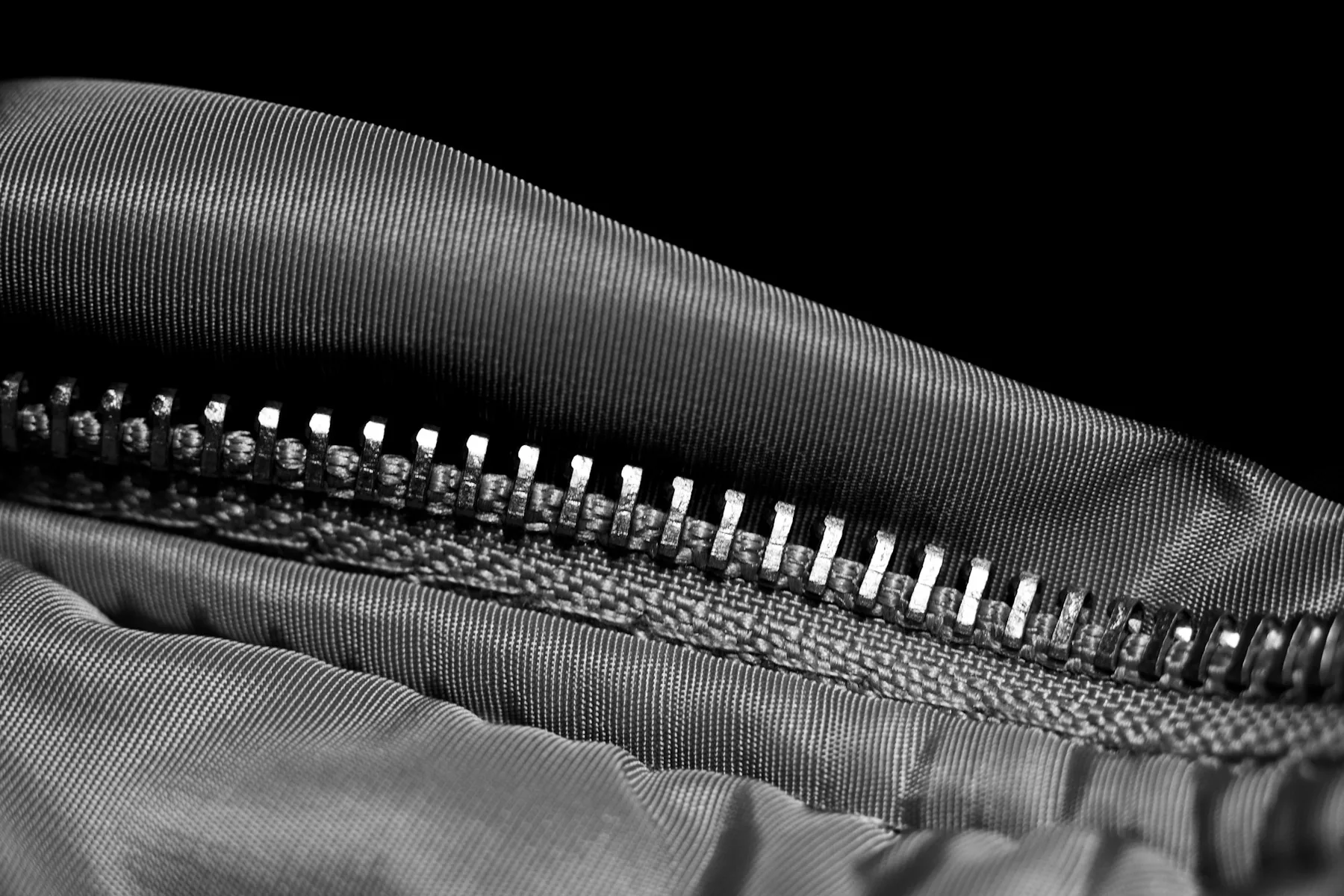 Close detail of a zip closure on technical fabric