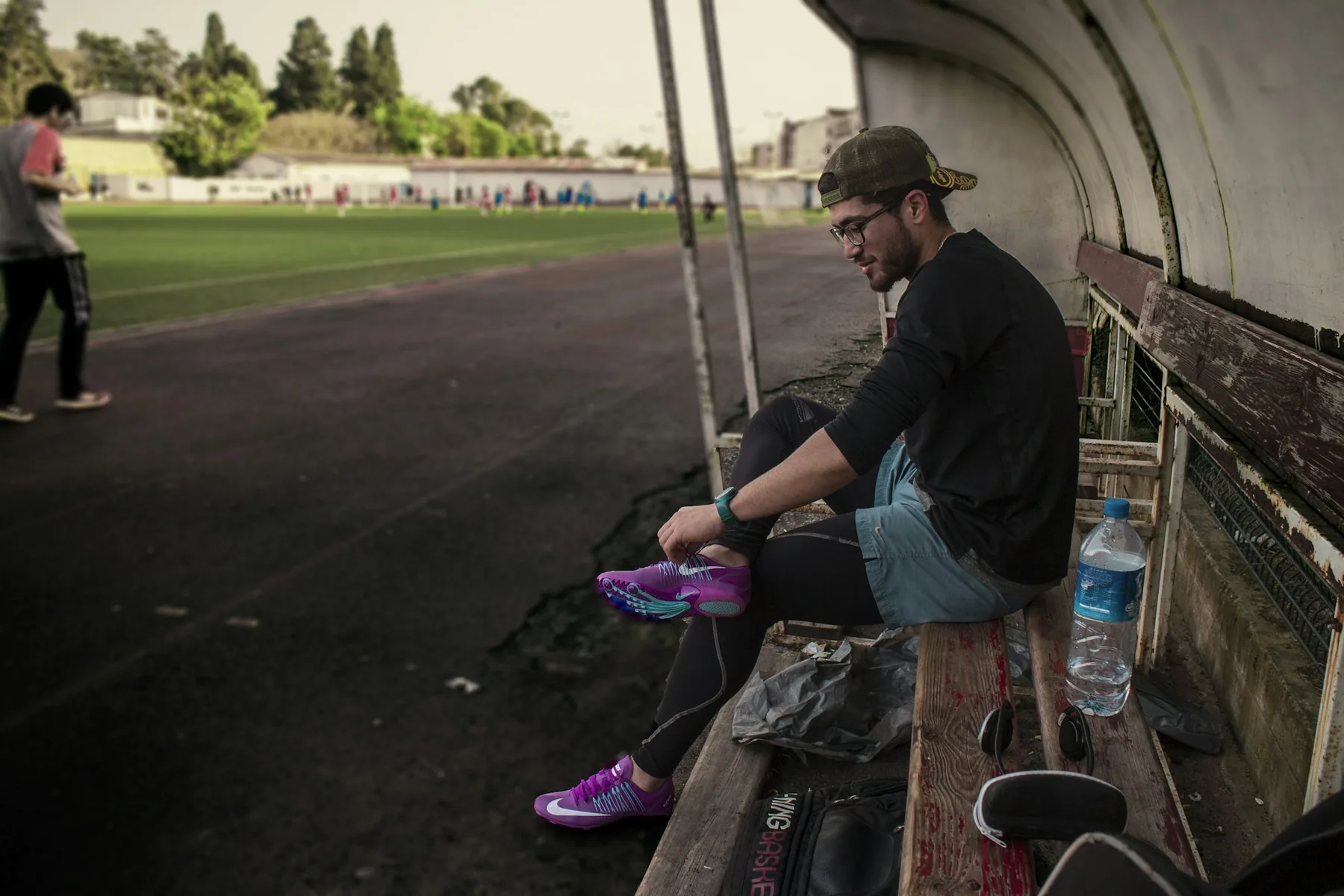 Athlete resting on a bench after a run