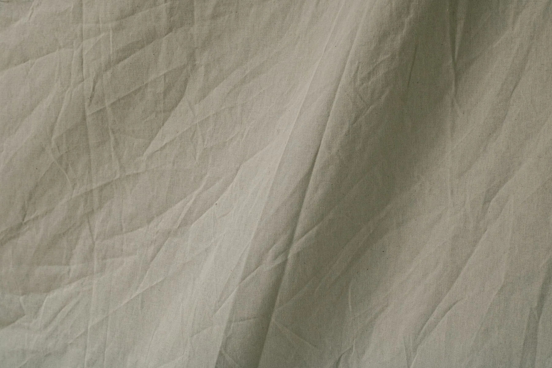 Fabric held up to the light showing translucency