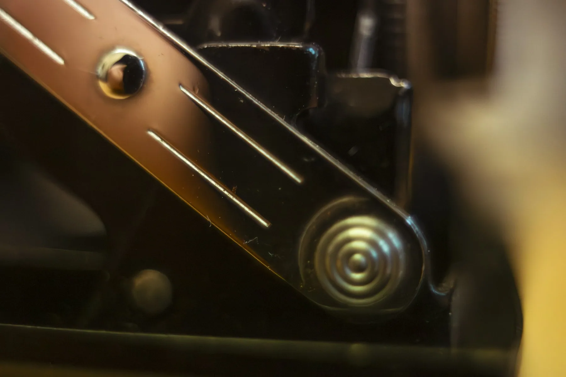 Close detail of a stationary bike flywheel and crank