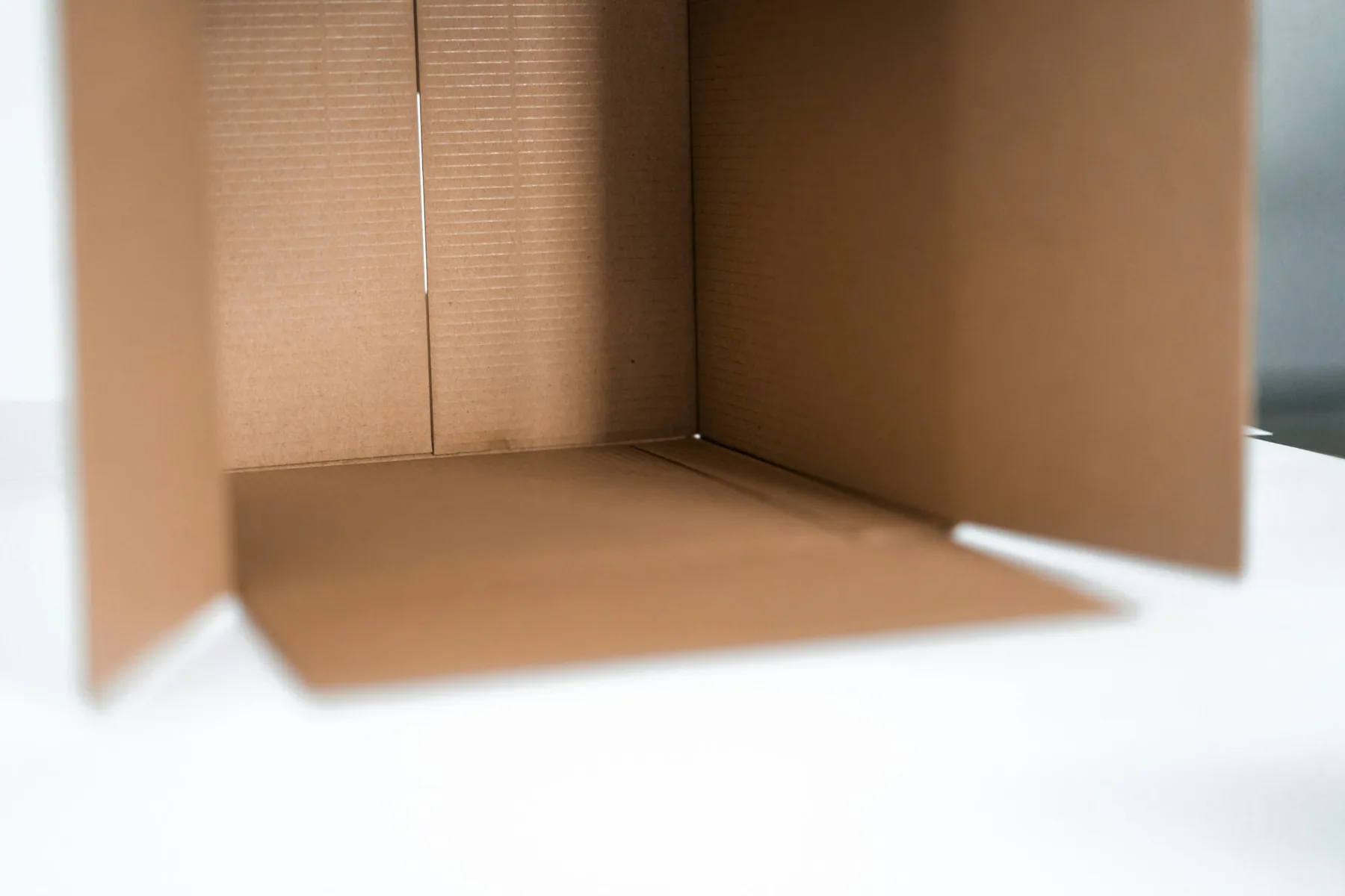 An open, empty cardboard box