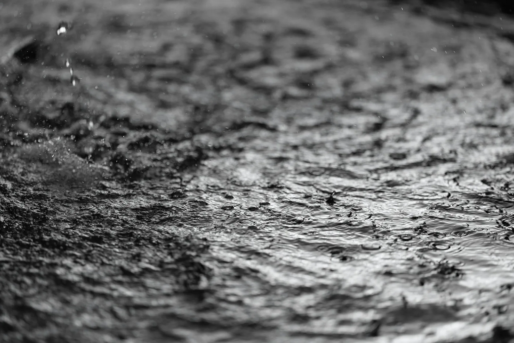 Hands mending fabric, black and white