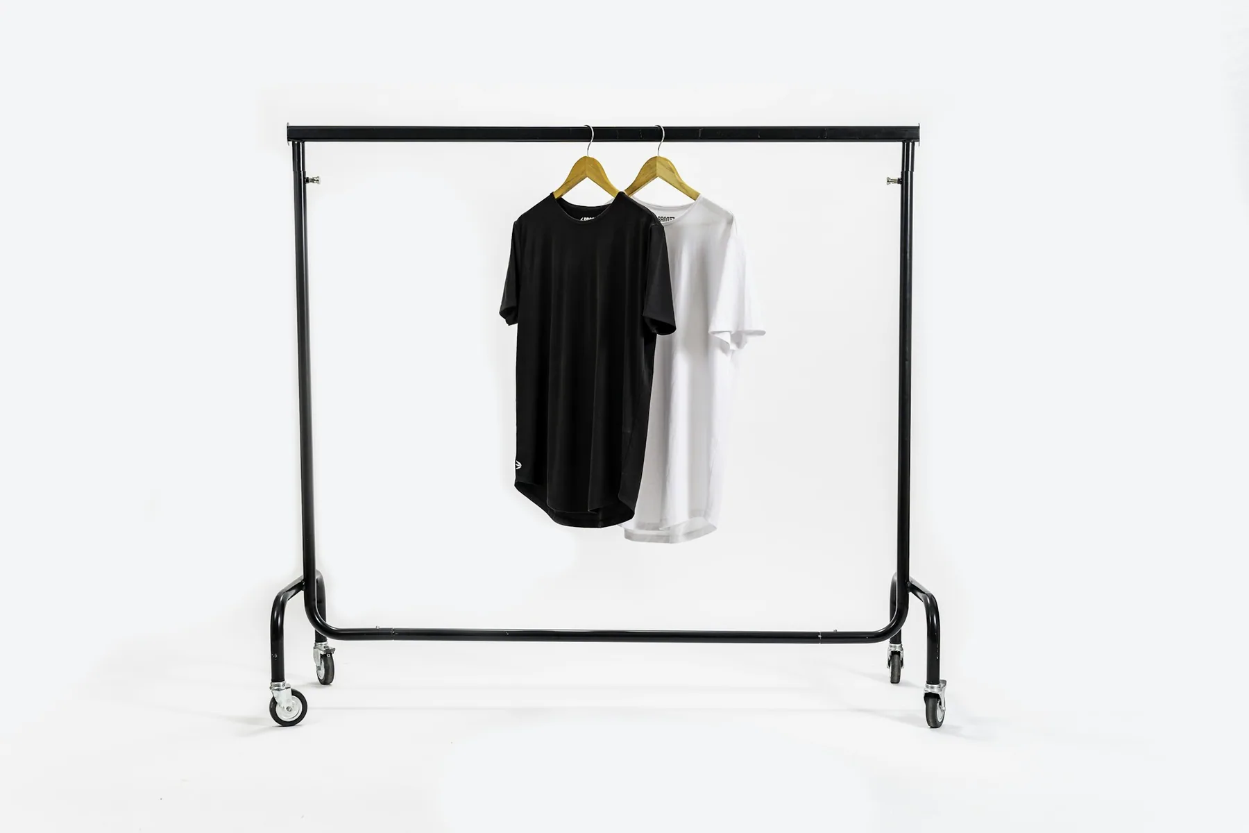 A single black t-shirt on a garment rail