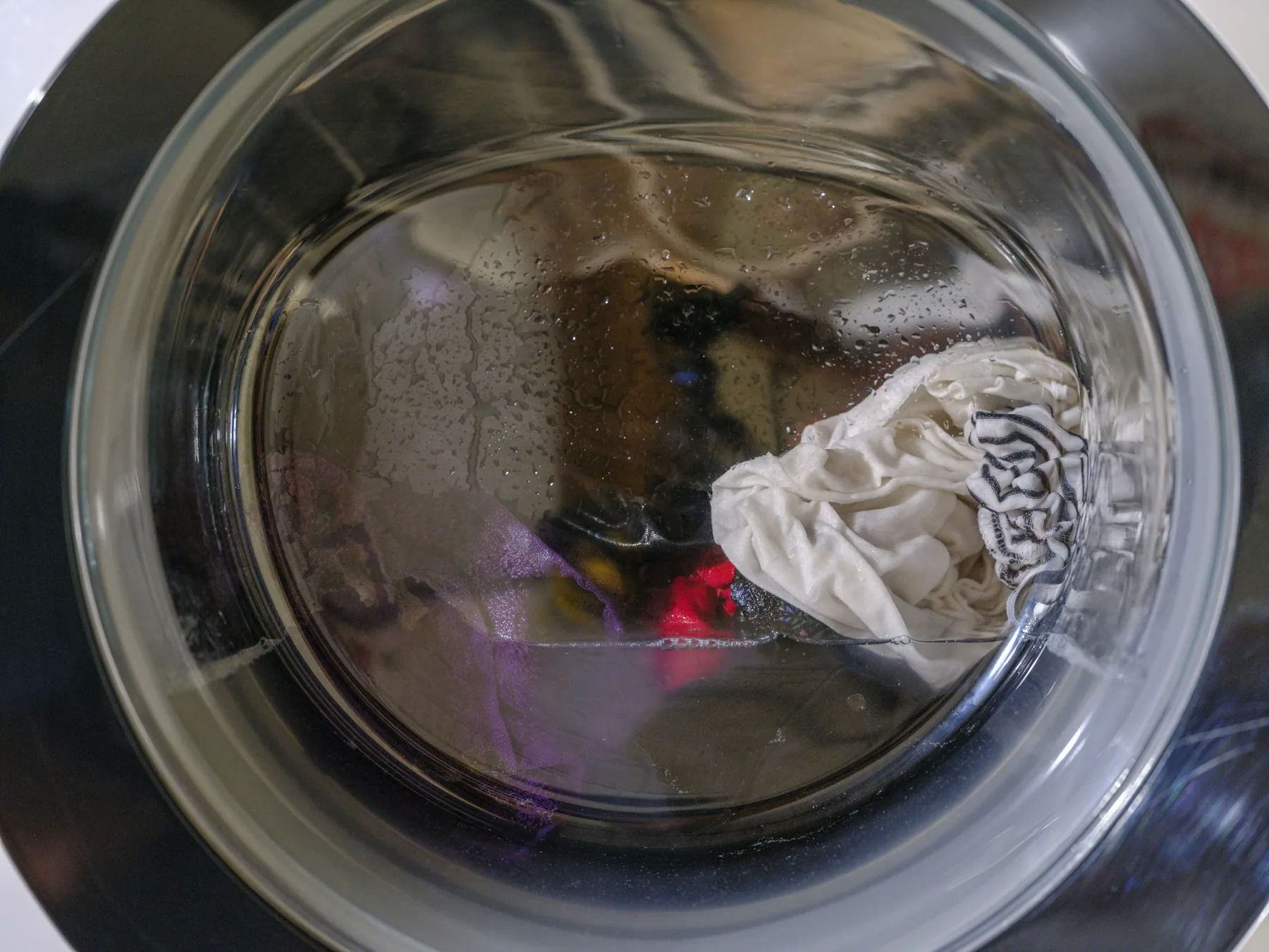 Washing machine drum loaded with clothes