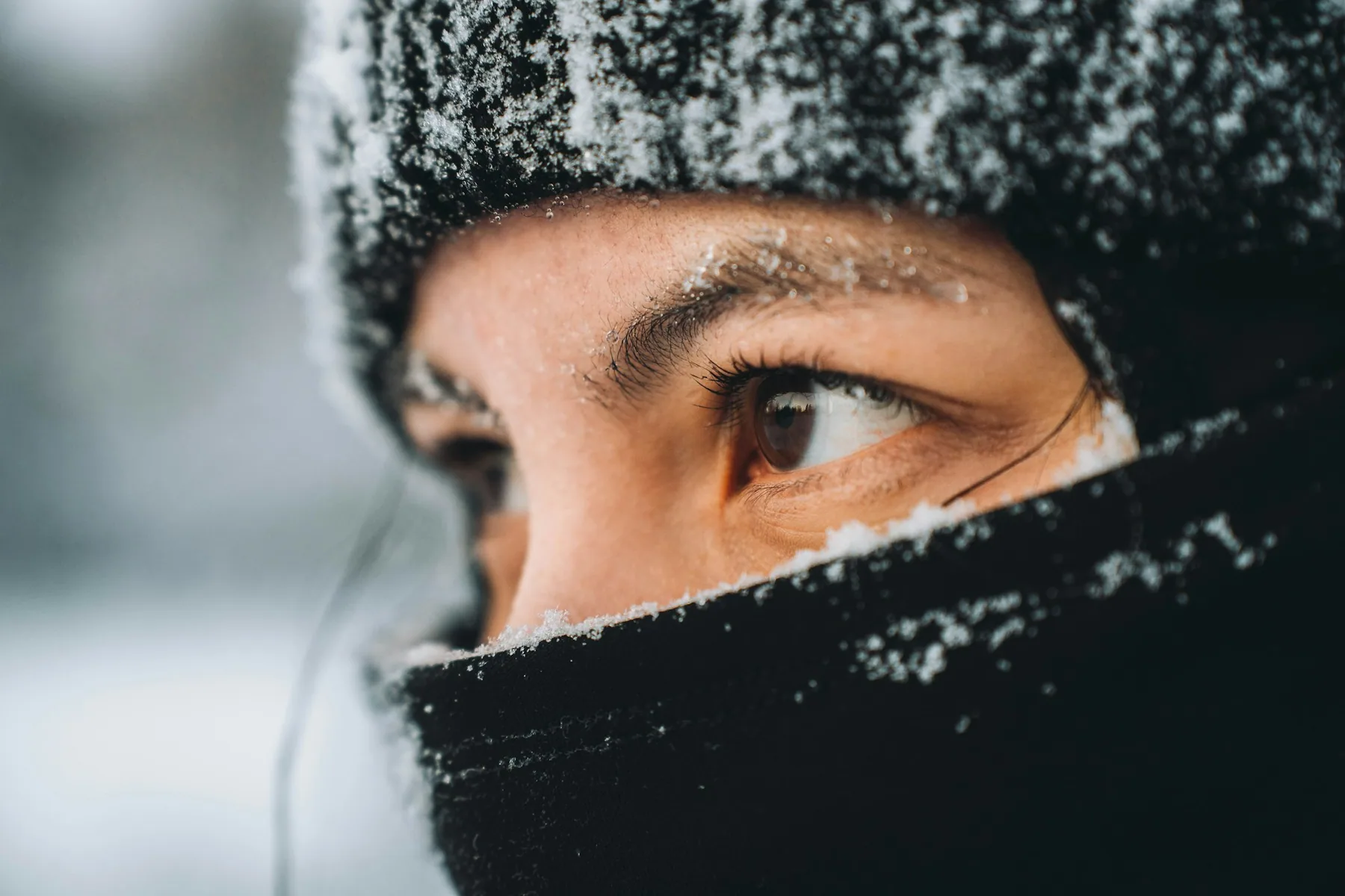 Close portrait in a knitted hat in cold weather