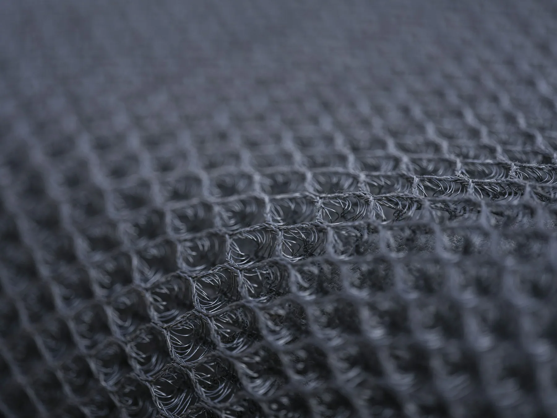 Macro detail of an open mesh knit