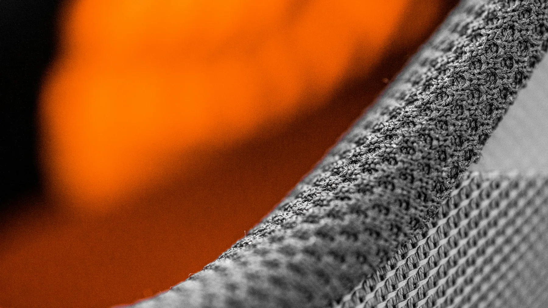 Close detail of a bonded seam on grey technical fabric