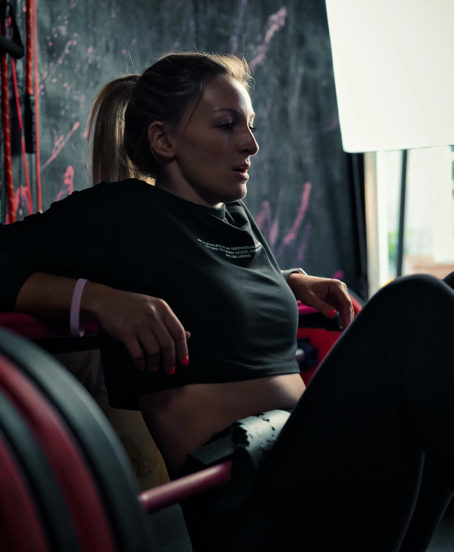 Athlete strength training in a dark gym