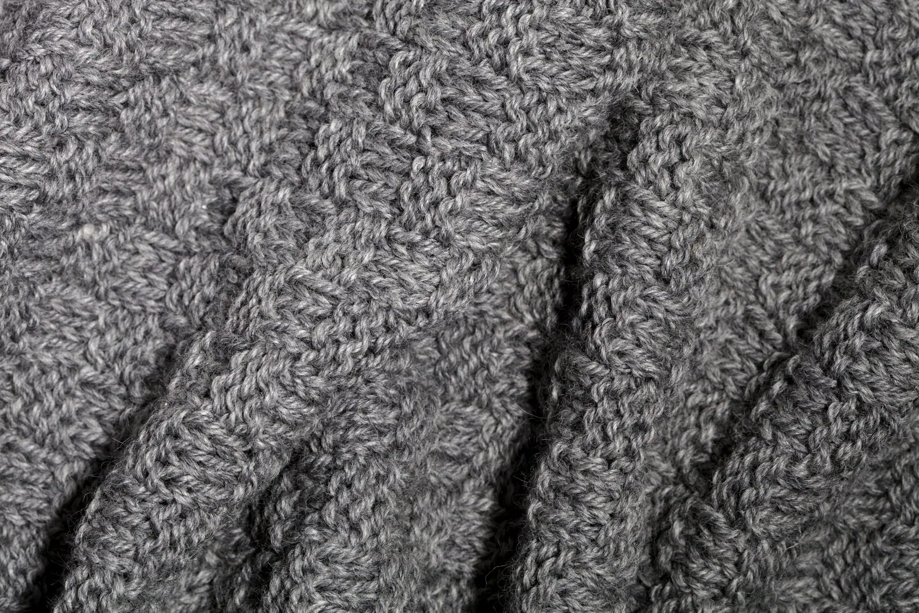 Macro detail of a grey ribbed knit