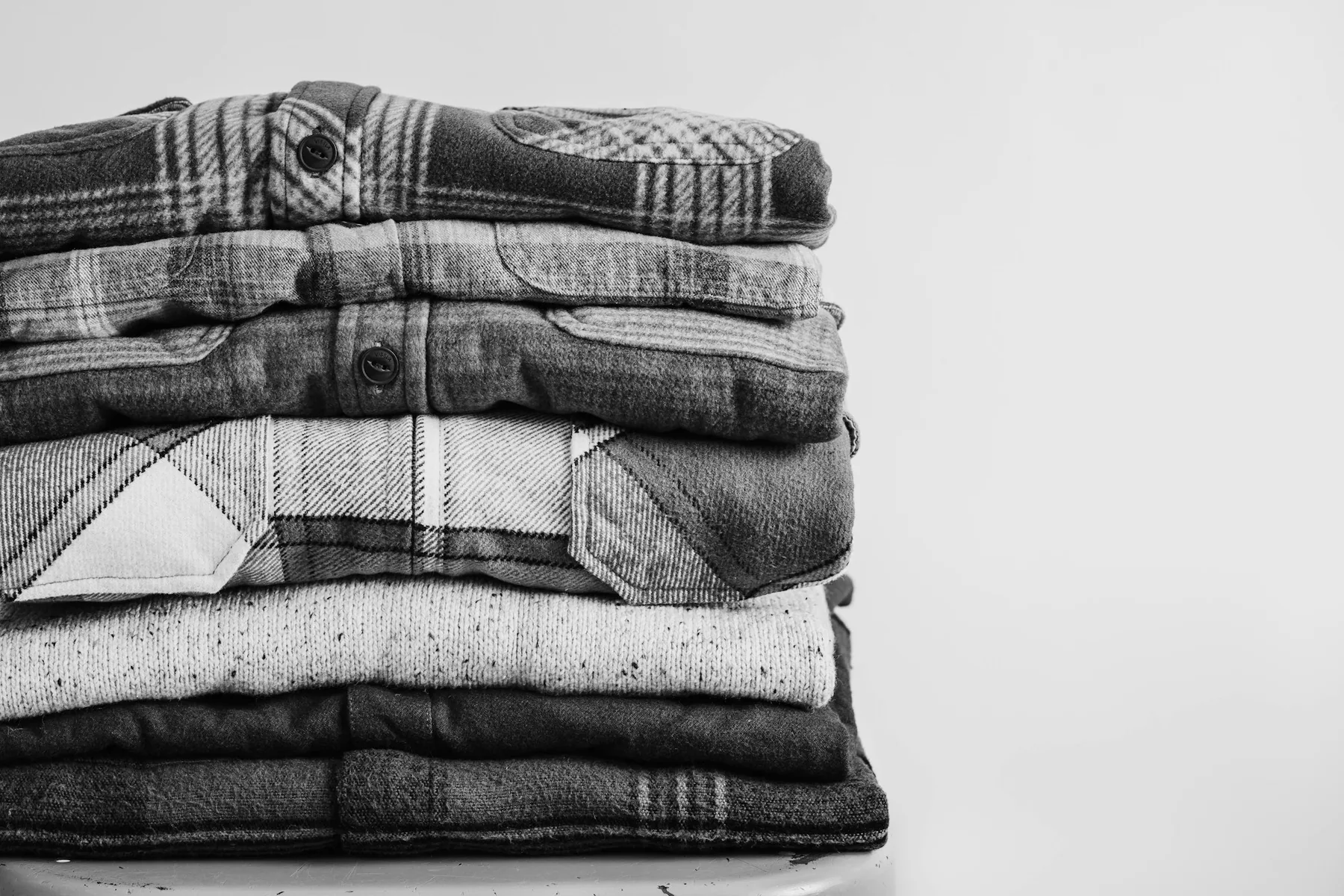 A folded stack of clean light garments