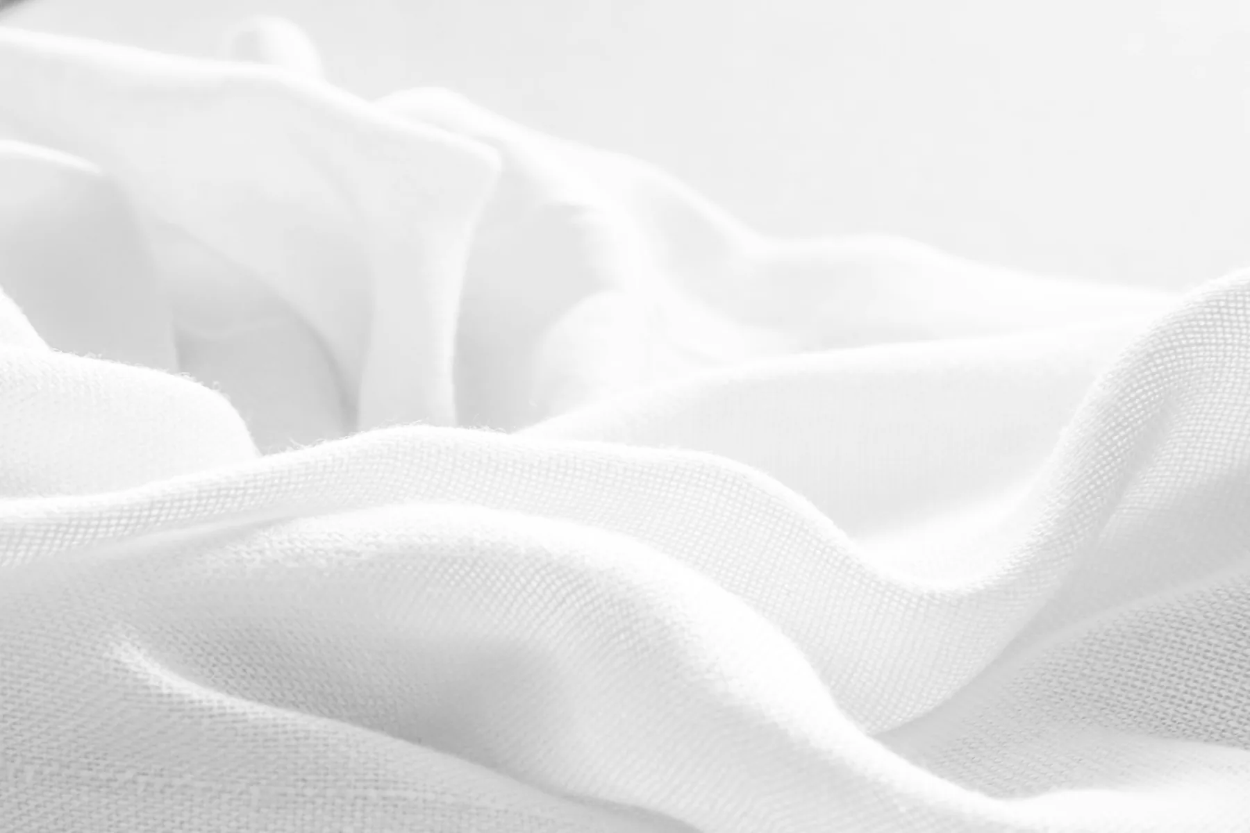 Creased white fabric showing age