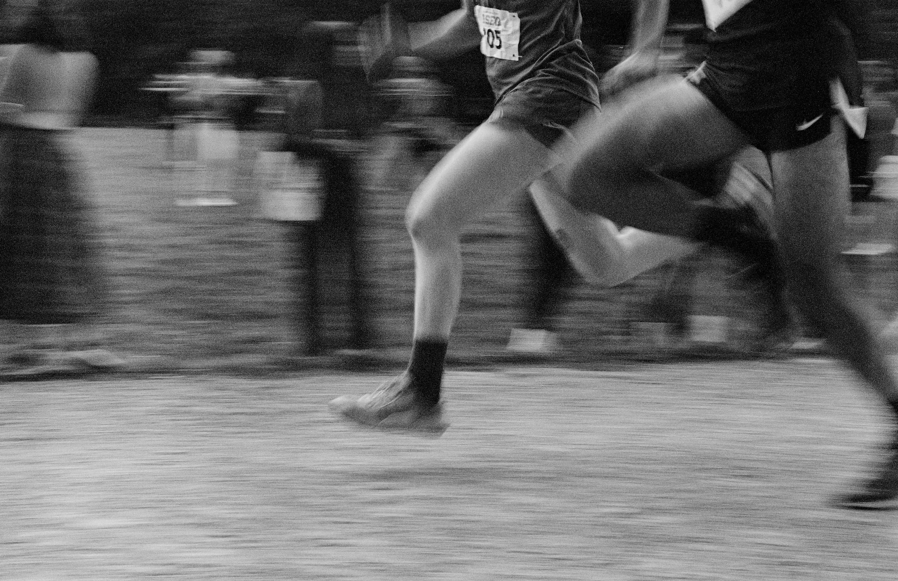 Runners mid-stride in short-inseam training shorts