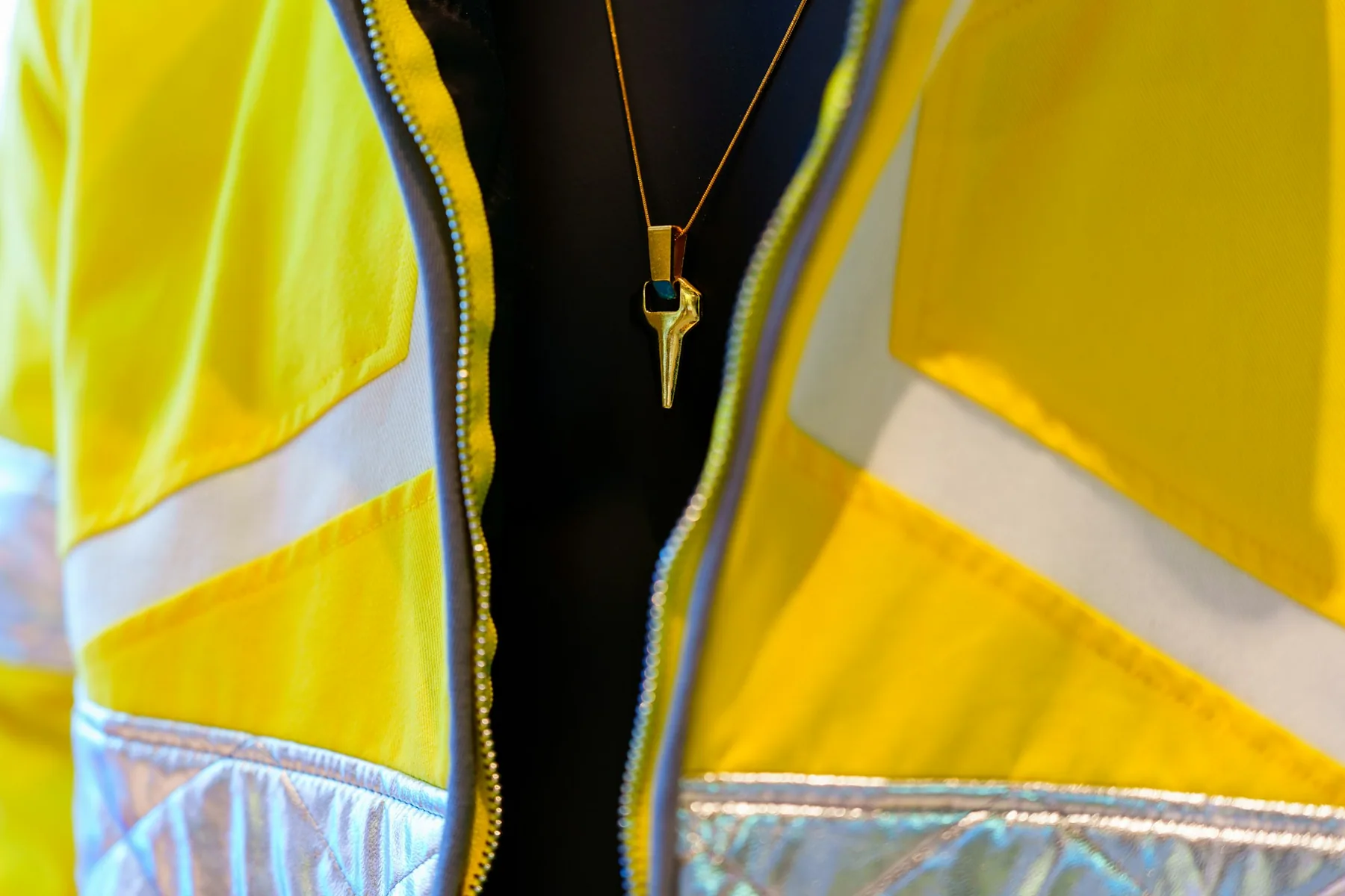 Close detail of reflective tape on a bright jacket