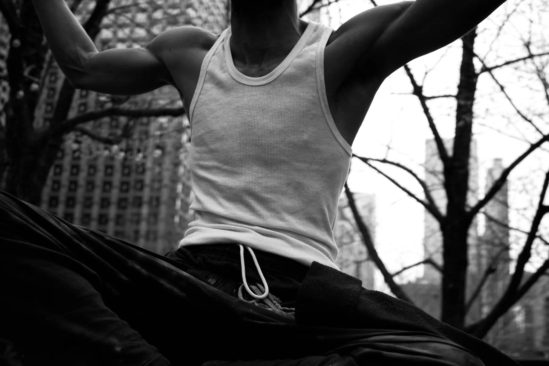 Athlete in a light training tank photographed in black and white