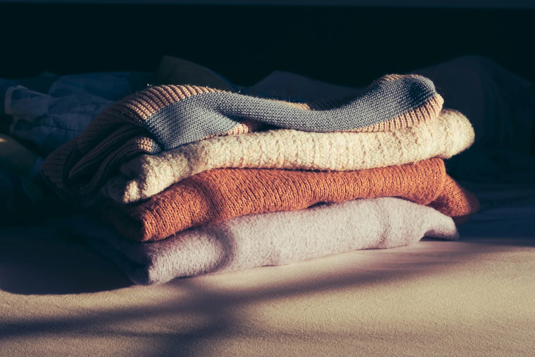 A stack of folded training t-shirts
