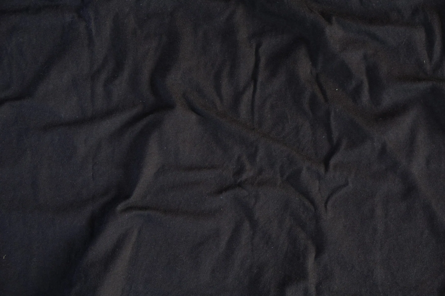 Macro detail of dark stretch fabric