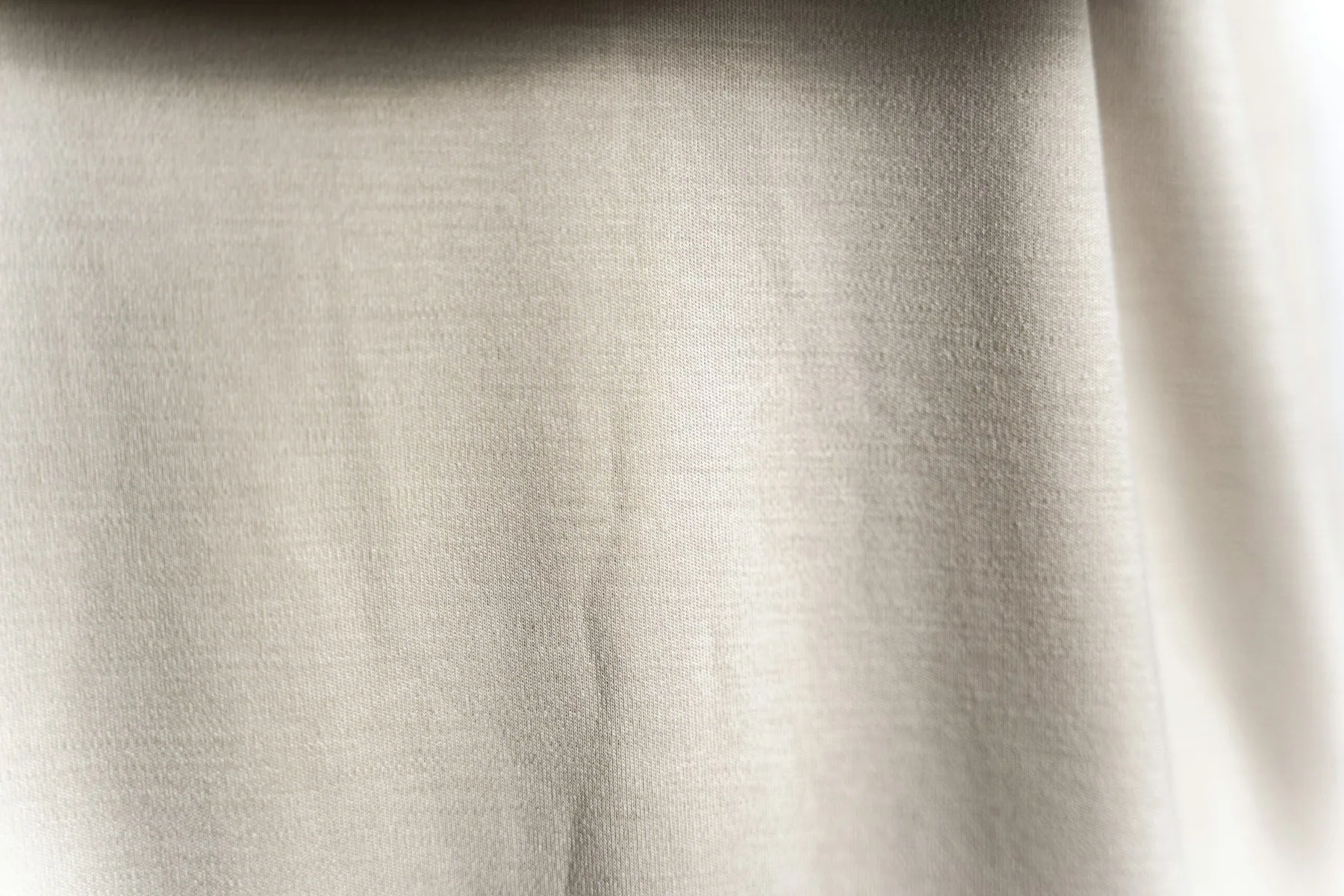 Pale fabric held up to the light